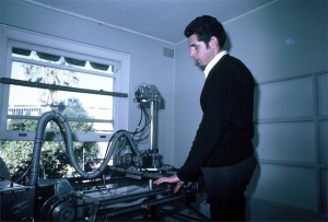 Ian Shepherd examining rails of breast scanner for pitting (1969)