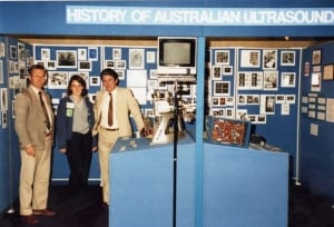Graham Lange, Belinda Moses, Ian Shepherd with history display at WFUMB'85