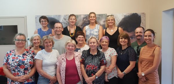 ASUM Outreach volunteer tutors with KAMS doctors and midwives who attended the course.